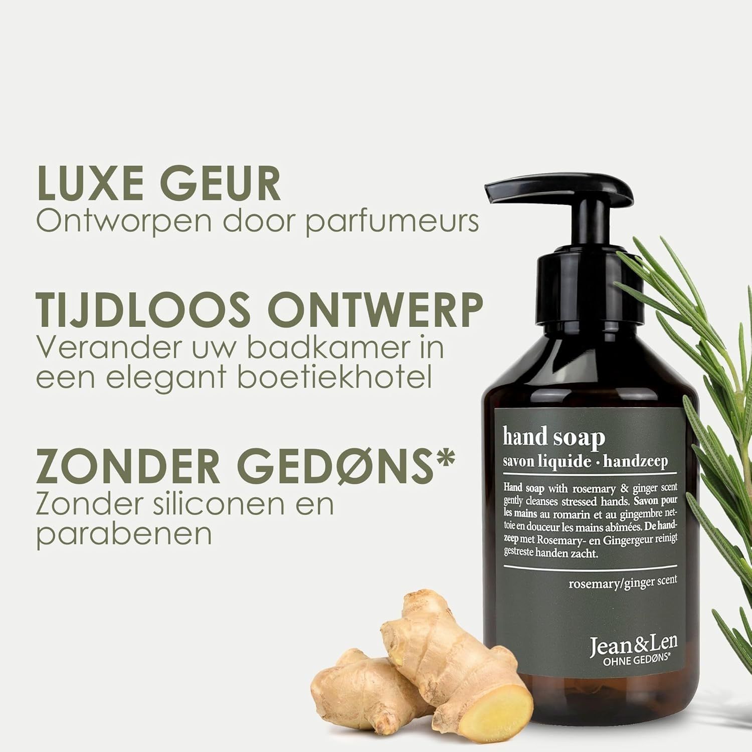 Donker flesje handzeep met geur rozemarijn-gember, naast verse gember en rozemarijntak.