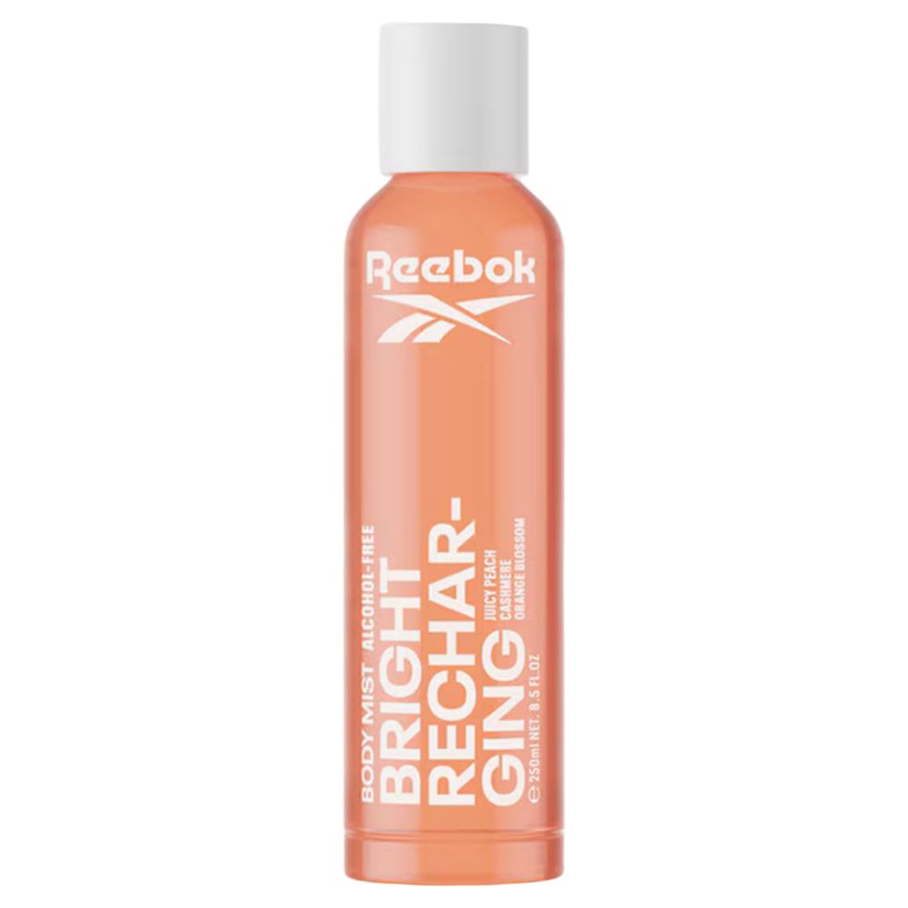 Oranje fles met witte dop. Tekst: Reebok, Bright Recharging, alcoholvrij. Geur: Juicy Peach, Cashmere, Orange Blossom.