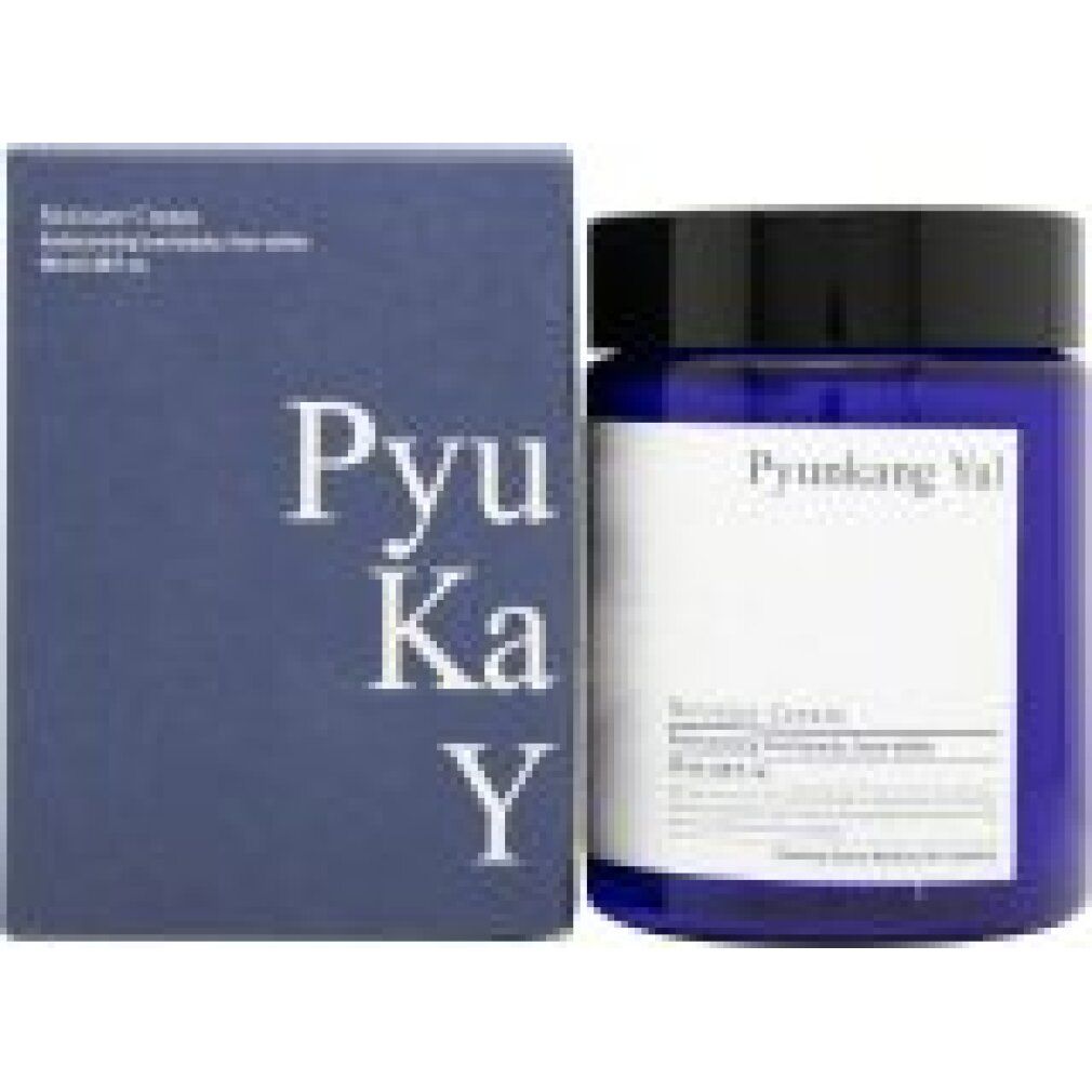 Crème hydratante Pyunkang Yul à côté de sa boîte d'emballage bleue.