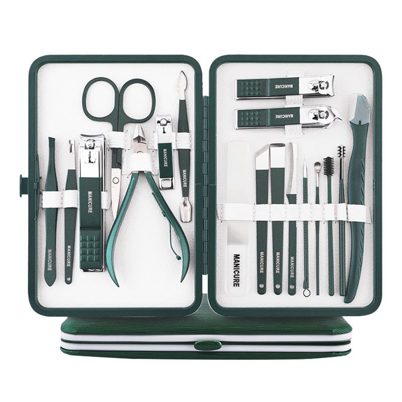 Donkergroene manicure set met 16 tools, geopend en neergezet.