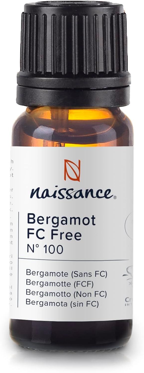 Bruine glazen fles met etiket. Tekst: Naissance Bergamot FC Free. Logo: Naissance.