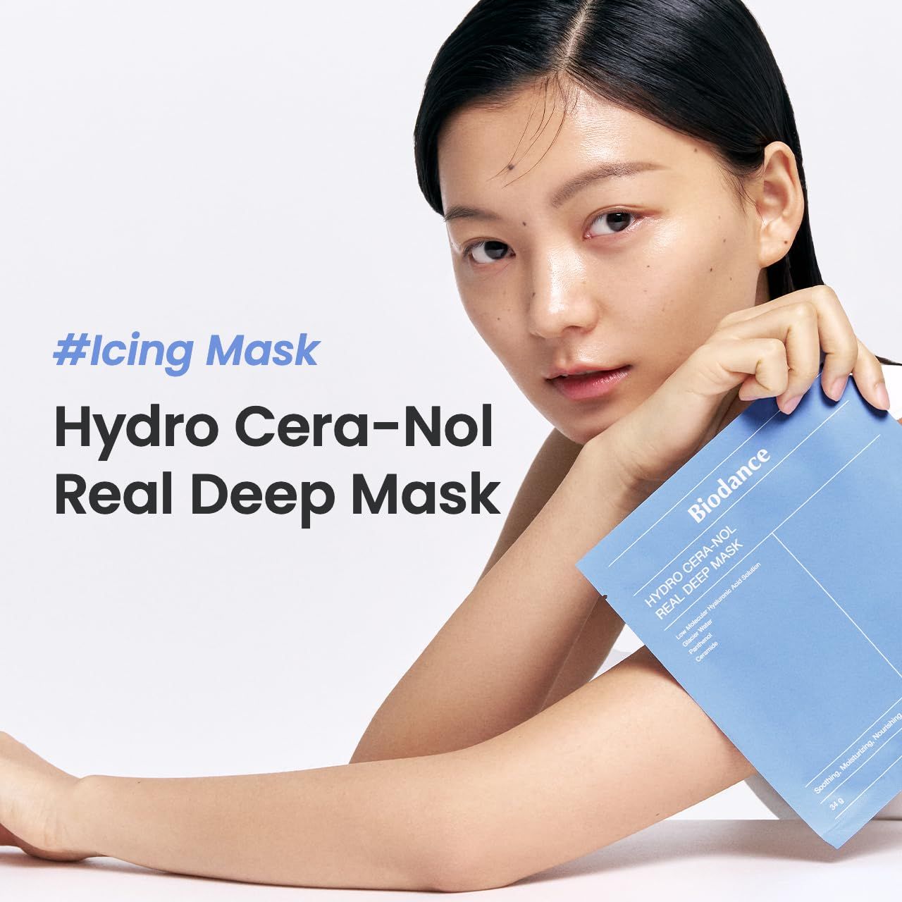 Femme tenant un sachet bleu. Texte : #Icing Mask, Hydro Cera-Nol Real Deep Mask, Biodance. Peau claire, fond blanc.