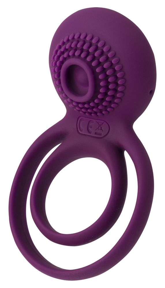 Paarse penisring met twee ringen en stimulator. Bovenkant met noppen en CE-markering. Zichtbare opening.