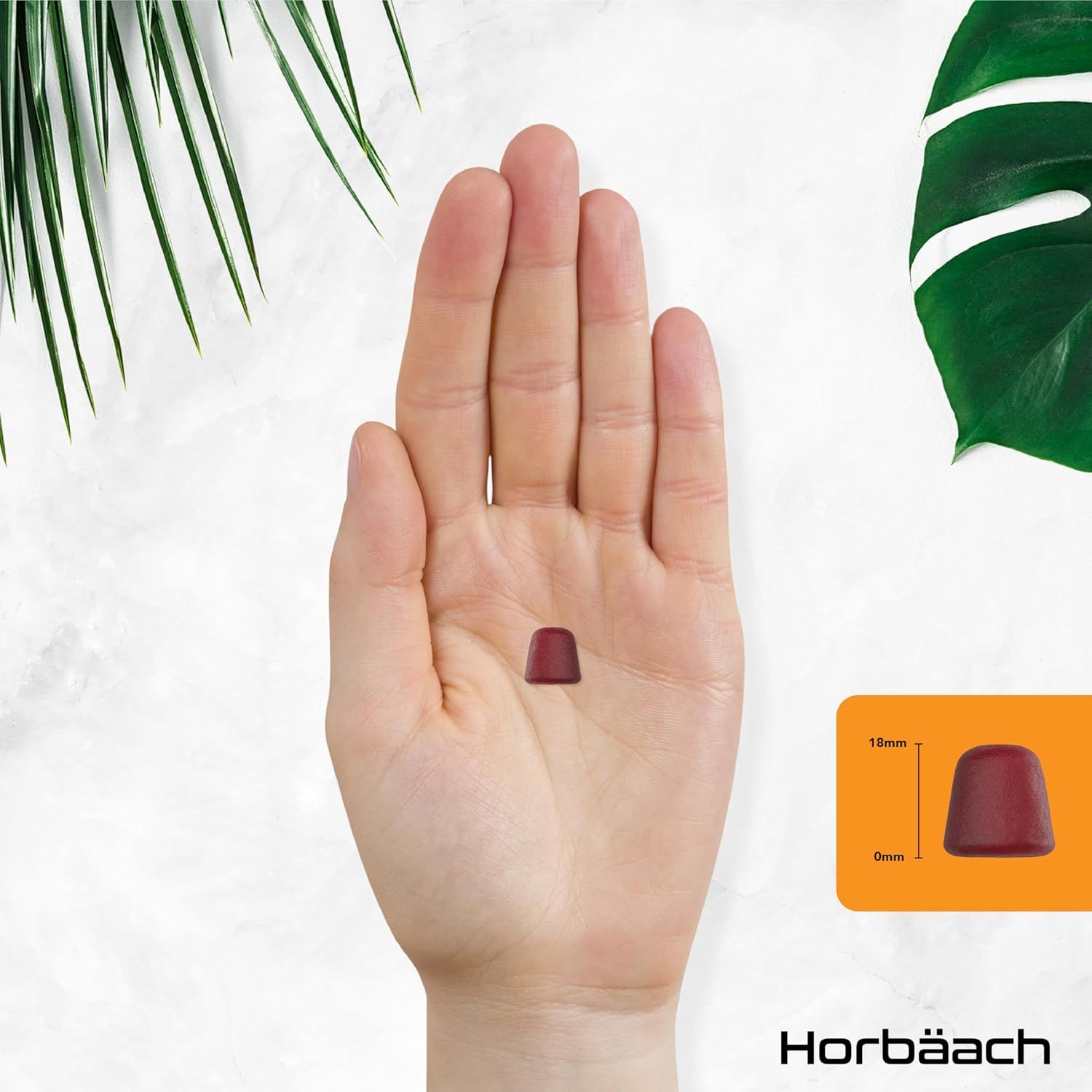 Gomme rouge sur une paume. Dimensions : 15mm de haut, 9mm de large. Logo Horbaach.