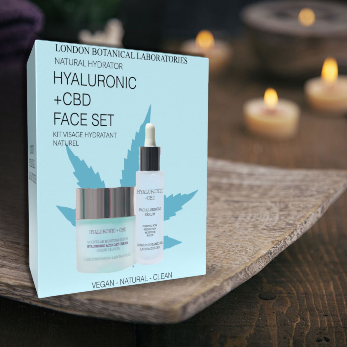 Coffret cadeau avec crème et sérum. Emballage bleu clair avec nom du produit et motif feuille de cannabis. Végétalien, naturel, propre.