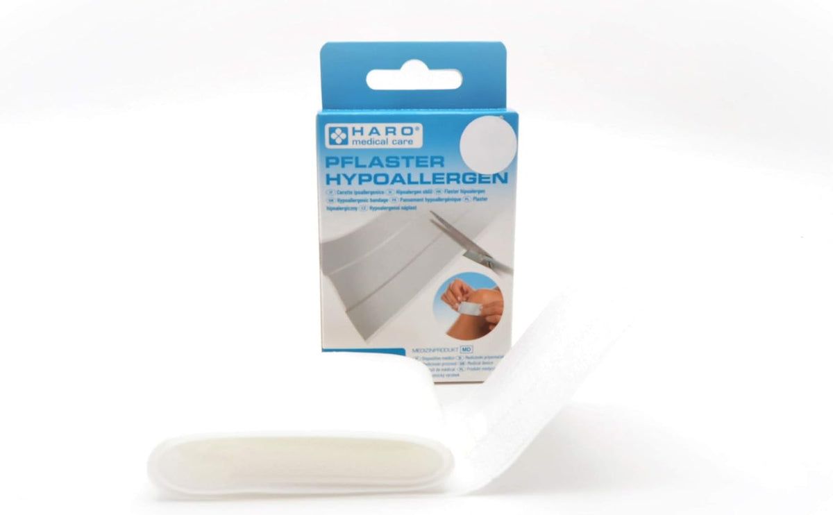 Haro Pflaster hypoallergen, verpakking geopend. Pleisterstrips zichtbaar. Verpakking blauw-wit. Medisch hulpmiddel.