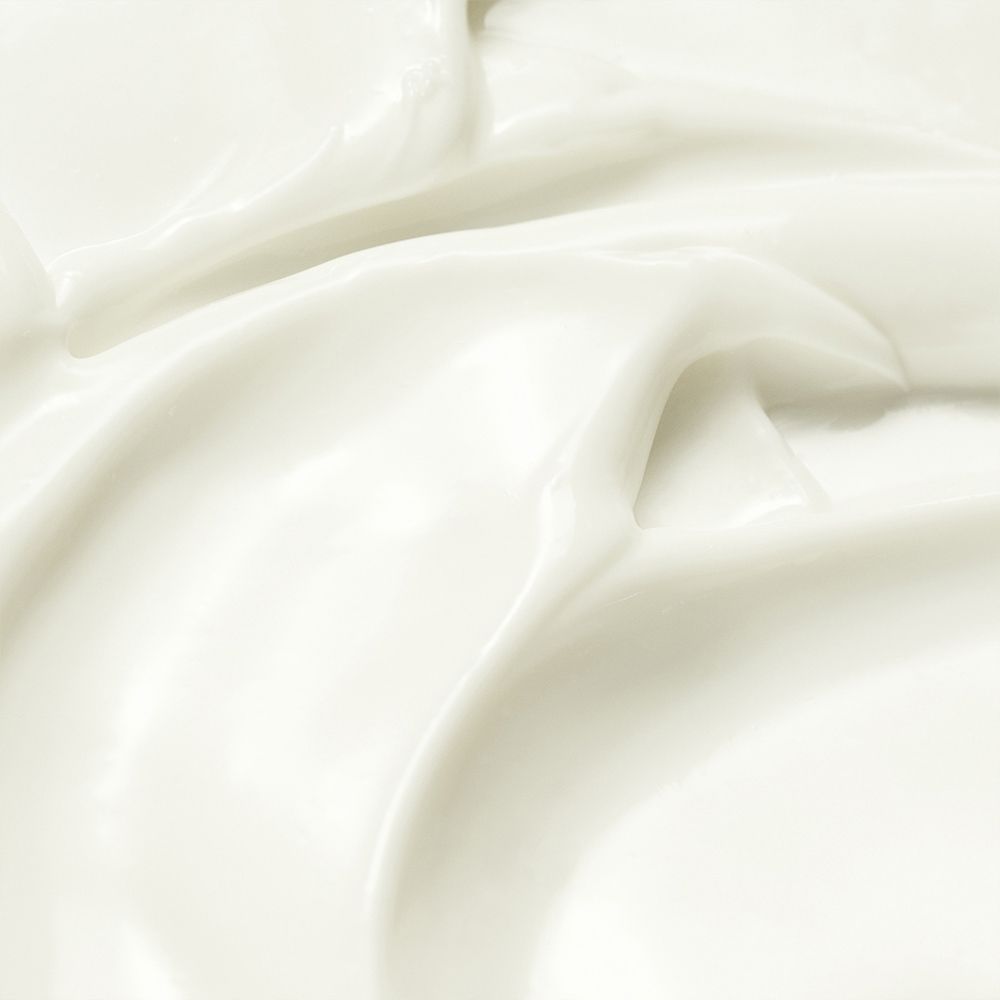 Close-up van de romige textuur van de PURITO Wonder Releaf Centella Daily Sun Lotion.