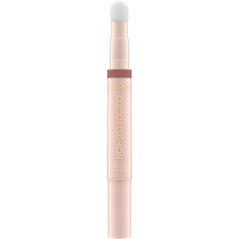 Lipolie met applicator. Tekst: COLOUR CUSHION JUICY LIP OIL. Roze pen met witte applicator. Merk: CATRICE.