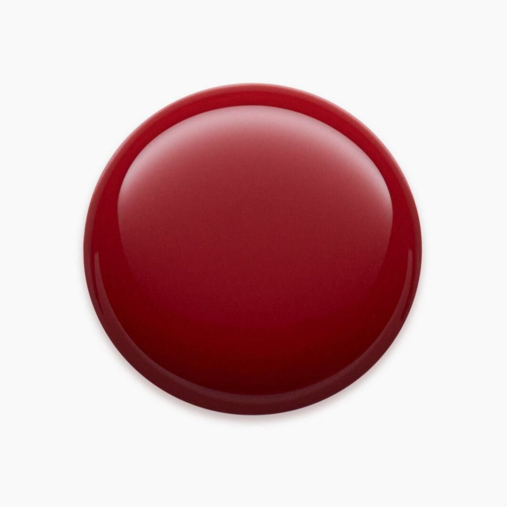 Pilule ronde, brillante, rouge foncé sur fond blanc.