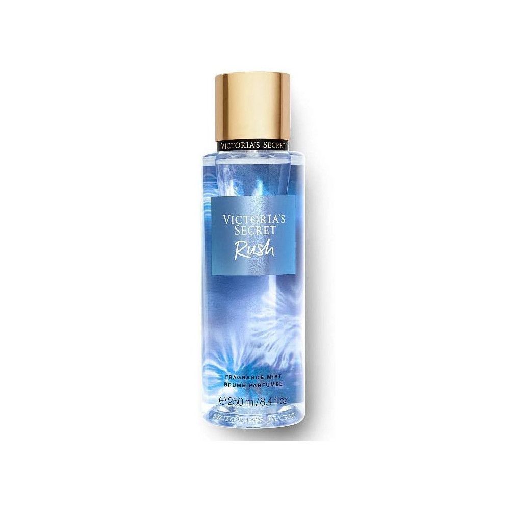 Brume parfumée Rush de Victoria's Secret. Liquide bleu dans flacon cylindrique, bouchon doré. Étiquette produit.