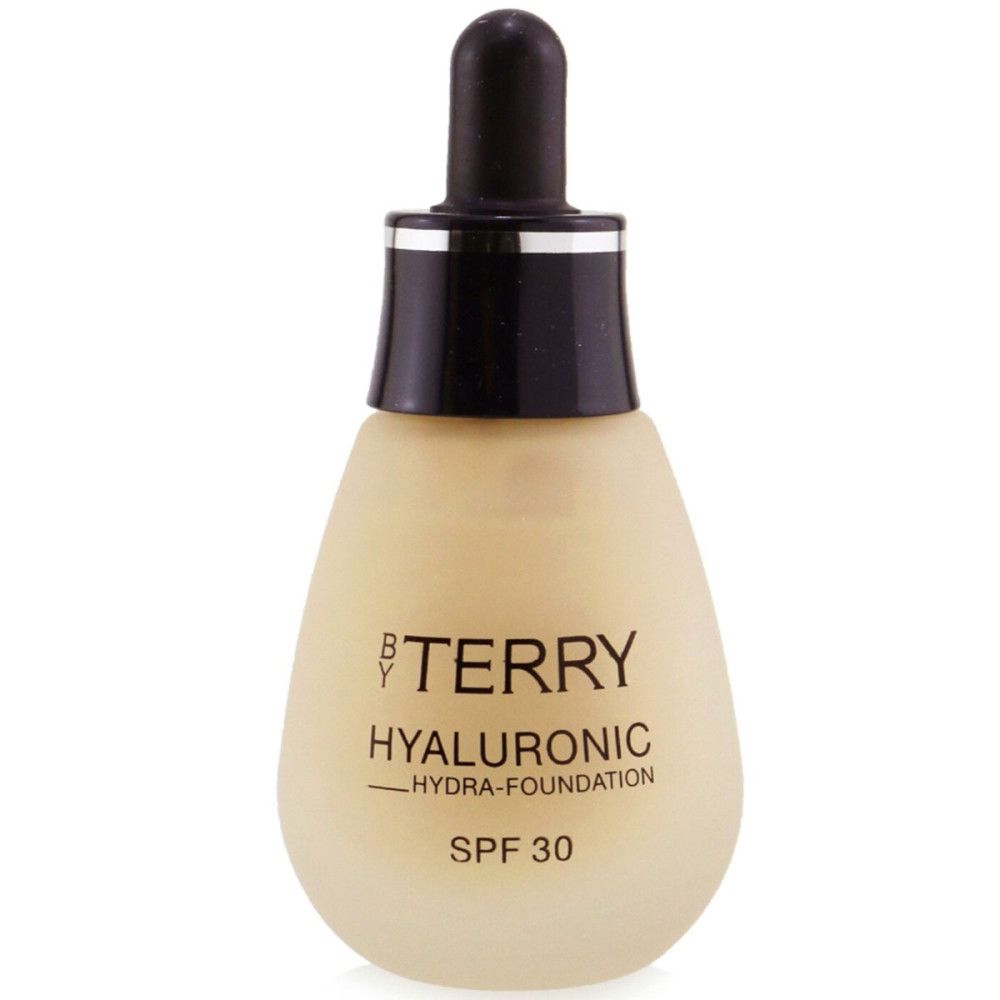 Beige fles met zwarte dop. Opschrift: BY TERRY, Hyaluronic Hydra-Foundation, SPF 30.