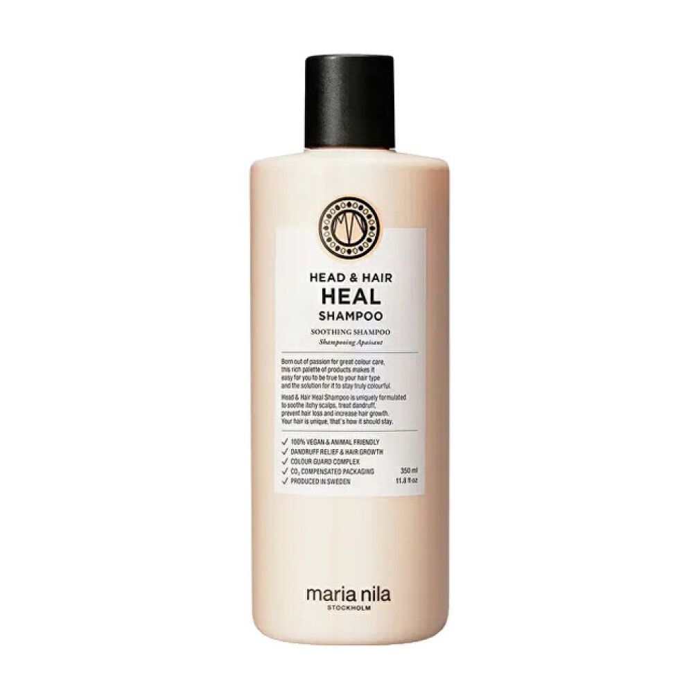 Beige shampoo fles met zwarte dop. Opschrift: HEAD & HAIR HEAL SHAMPOO. Merk: Maria Nila.
