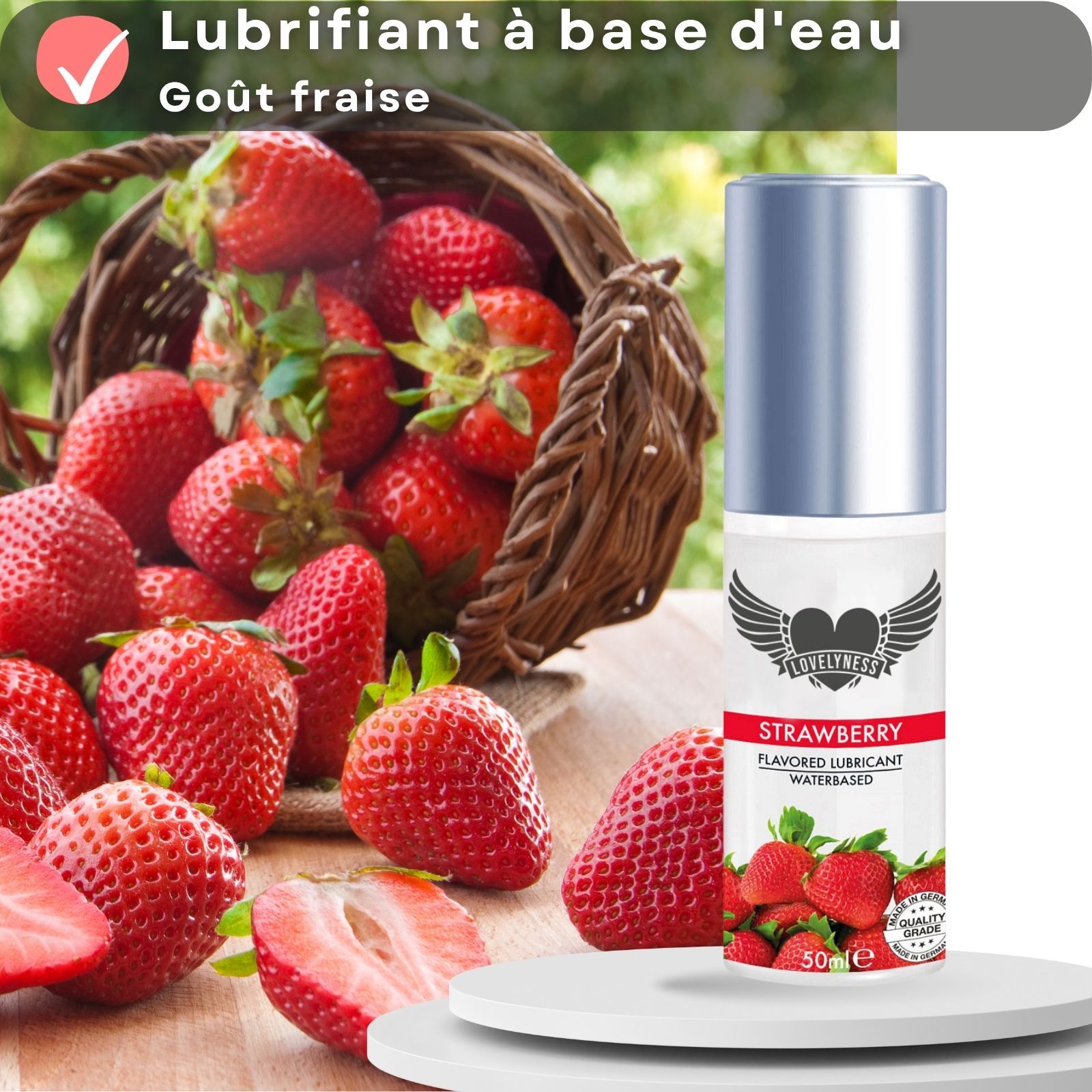 Flacon de lubrifiant avec fraises et texte. Texte : Strawberry, Flavored Lubricant, Waterbased.