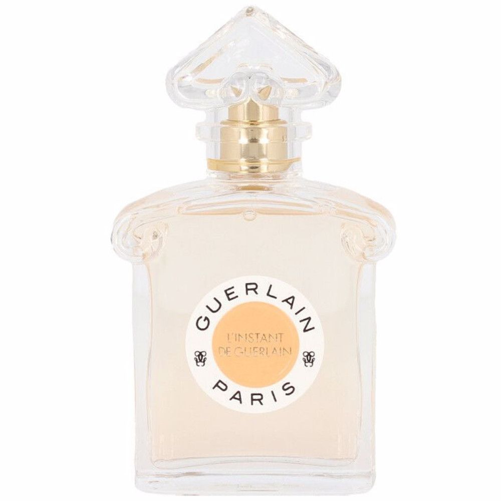 Parfumfles met rond etiket en tekst. Transparante fles met gouden dop.