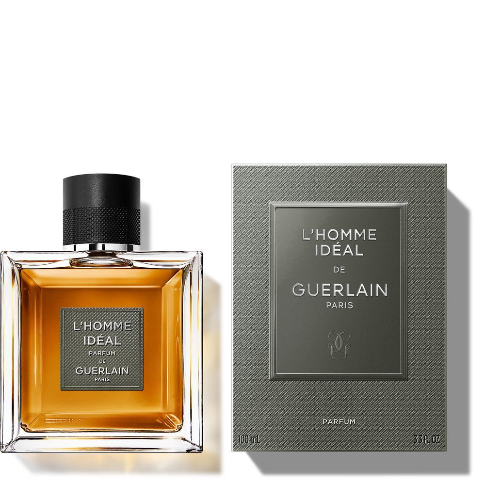 Flacon et emballage. Flacon avec bouchon noir, étiquette "L'HOMME IDEAL" et "GUERLAIN". Emballage avec texte.