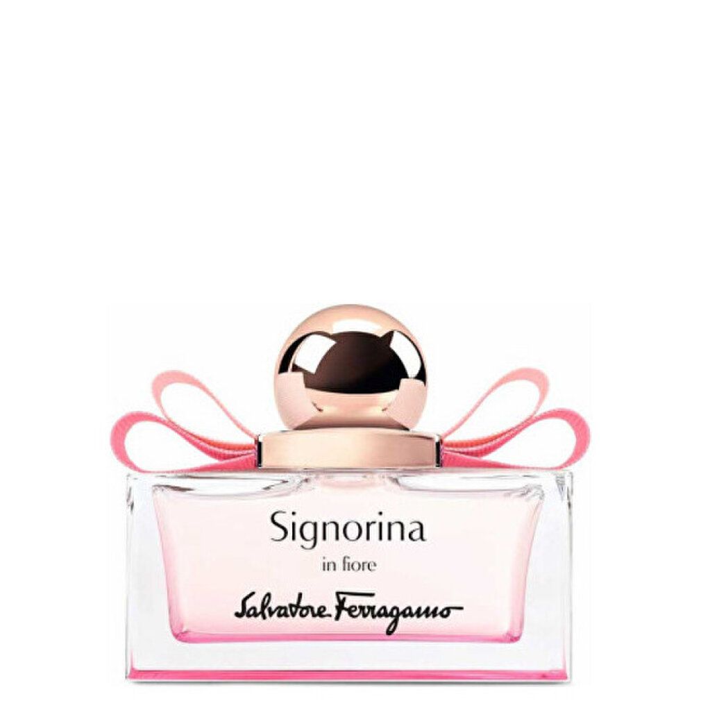 Parfumfles met roze vloeistof, roze strik en gouden dop. Opschrift: Signorina in Fiore, Salvatore Ferragamo.