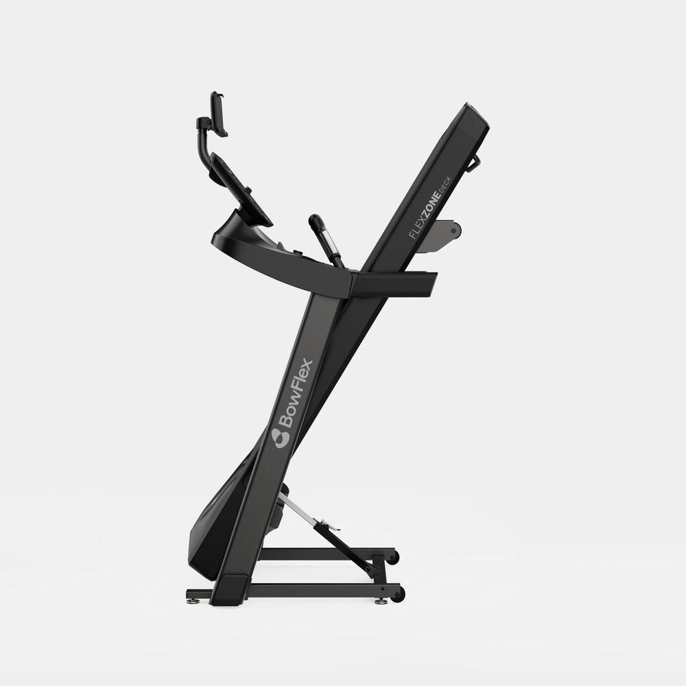 Tapis de course noir vu de côté. Technologie Flex Zone et logo BowFlex visibles.
