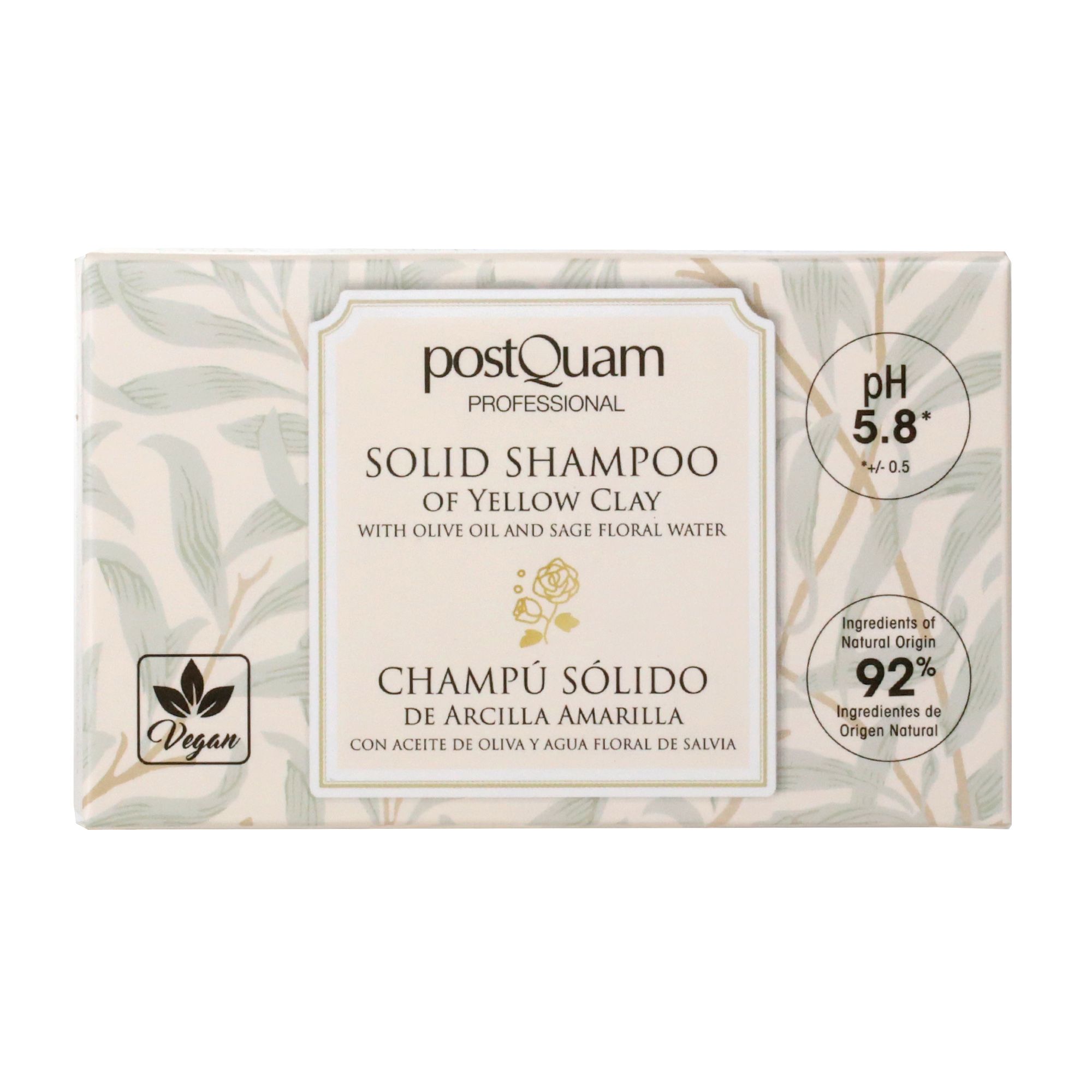 Verpakking voor vaste shampoo met gele klei. Opschrift: Postquam, Champú Sólido, pH 5.8, 92% ingrediënten van natuurlijke oorsprong, vegan.