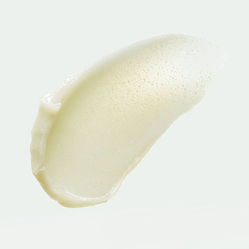 Spoor van licht crèmig product. Textuur met kleine deeltjes.