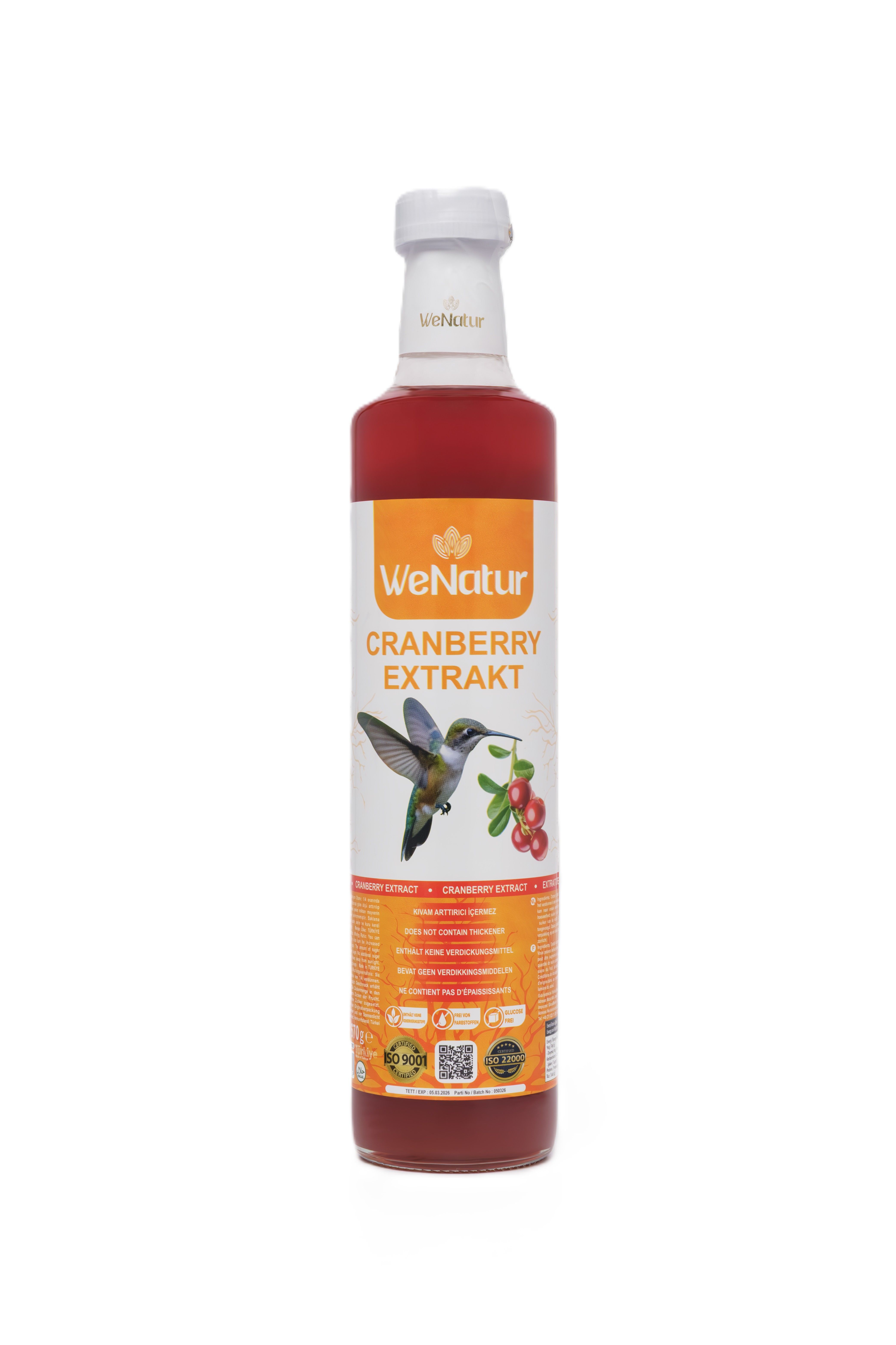 Bouteille d'extrait de canneberge, étiquette avec colibri et baies.