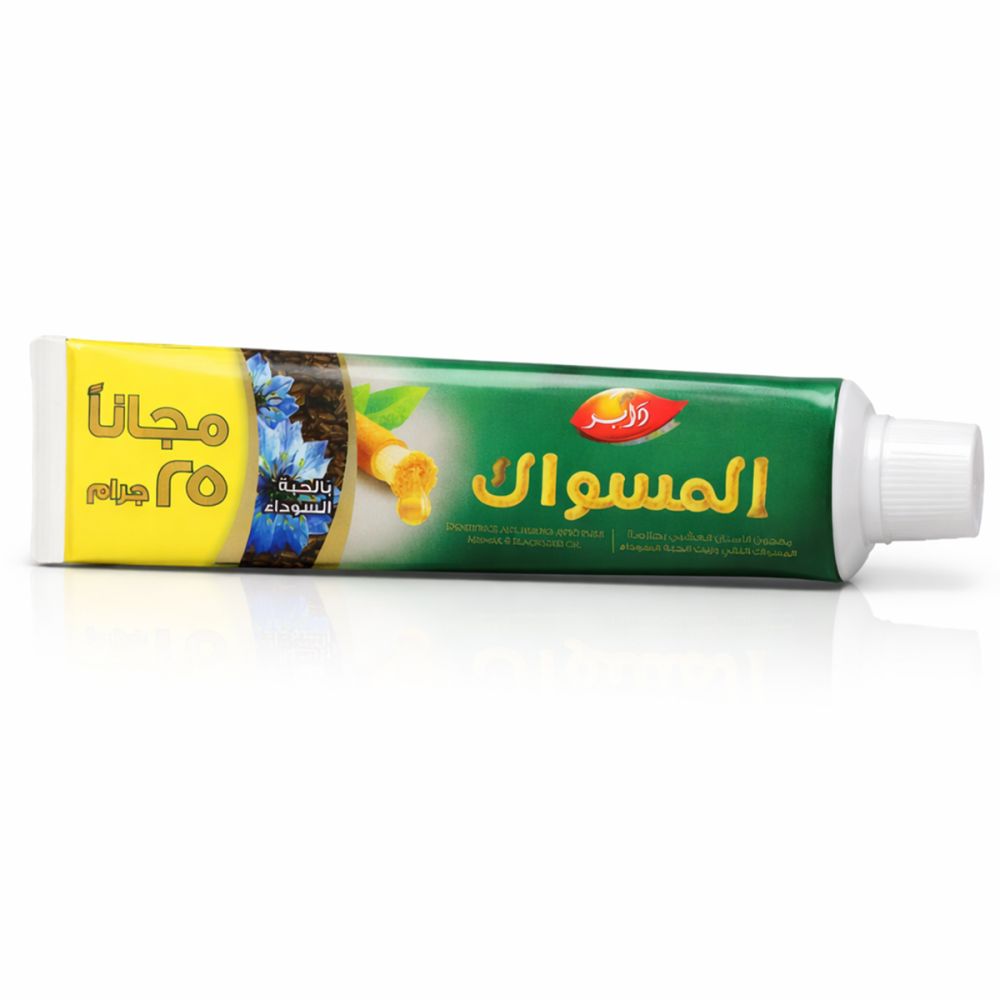 Groen-gele tandpastatube, Arabisch schrift. Opschrift: Miswak. Met zwarte komijnolie. Gratis 25g.