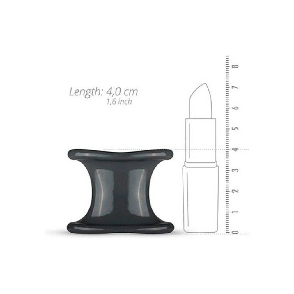 Écarteur de balles en silicone gris foncé à côté d'un rouge à lèvres. Longueur : 4,0 cm, 1,6 pouce. Forme : sablier. Matériau : silicone.
