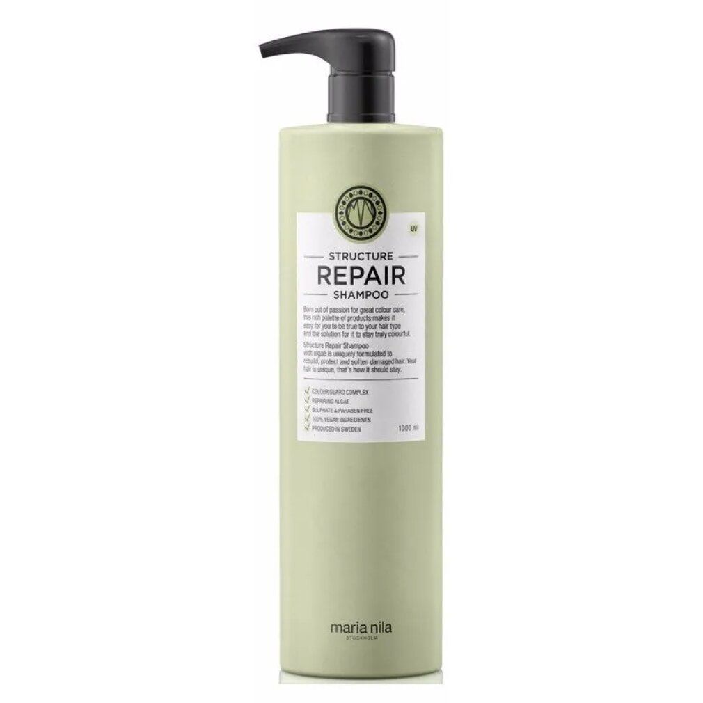 Bouteille vert clair avec distributeur noir. Étiquette "STRUCTURE REPAIR SHAMPOO" et "maria nila".