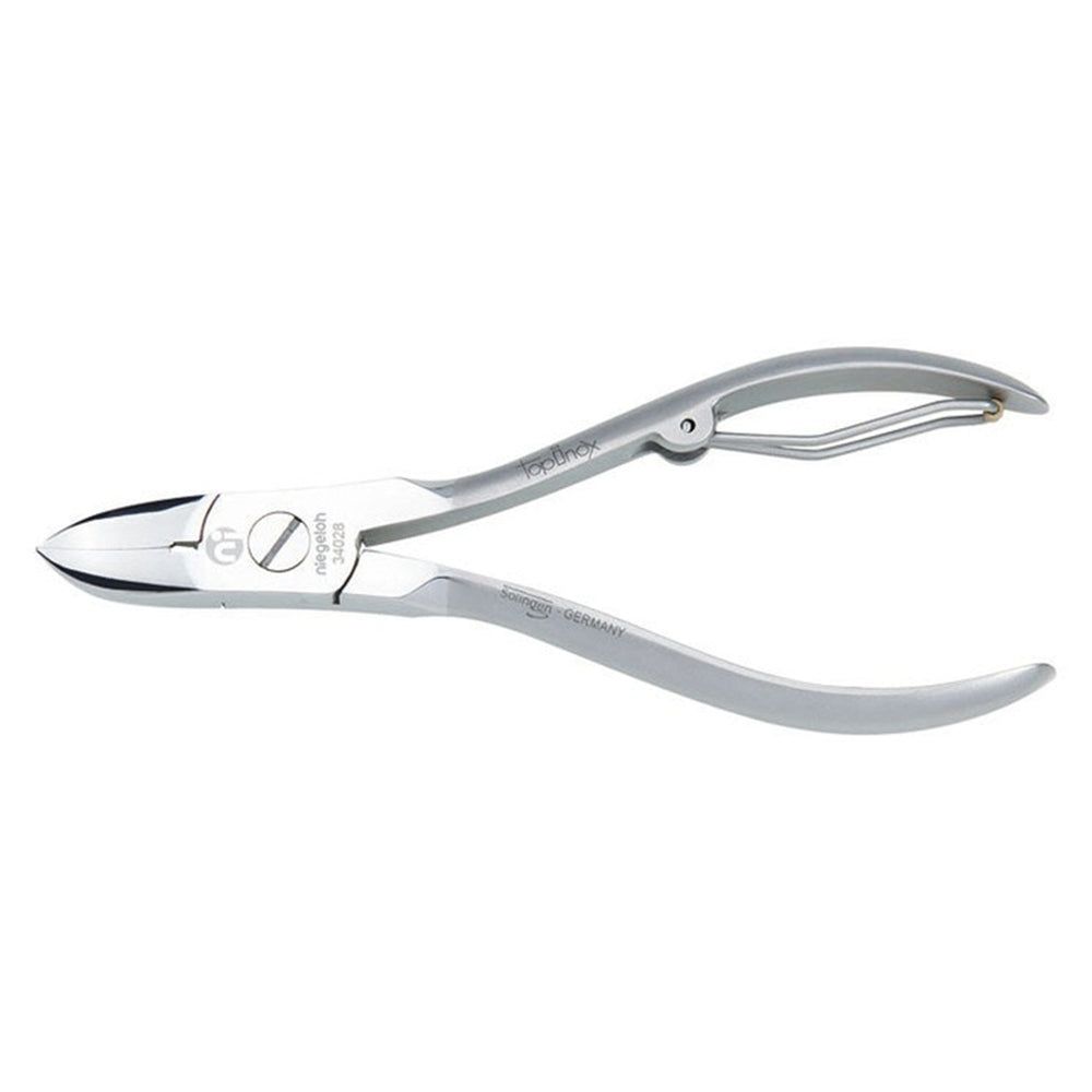 Niegeloh Solingen nagelknipper van metaal met gebogen mes en veer sluiting.