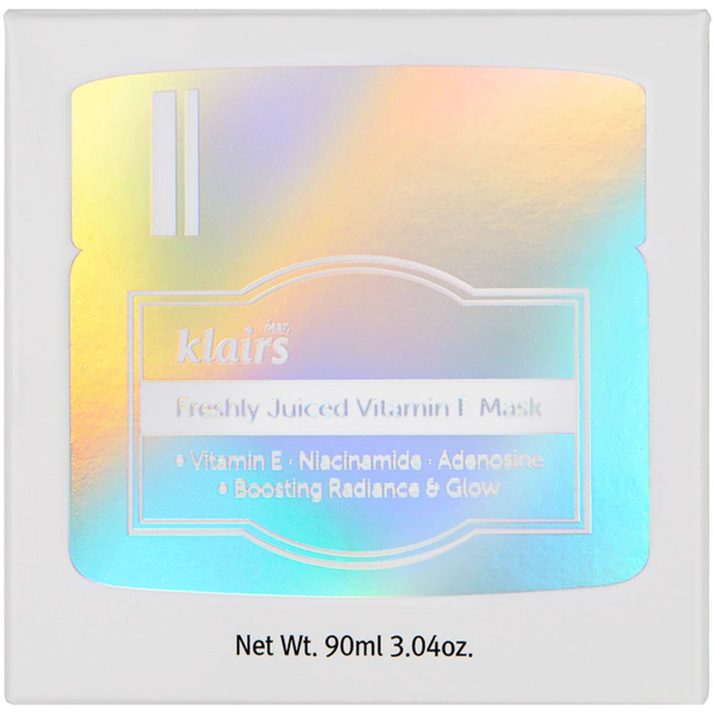 Productverpakking met holografisch effect. Opschrift: Dear, Klairs Freshly Juiced Vitamin E Mask. Bevat vitamine E, niacinamide, adenosine.
