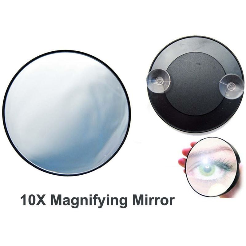 Miroir rond grossissant 10x avec deux ventouses à l'arrière.
