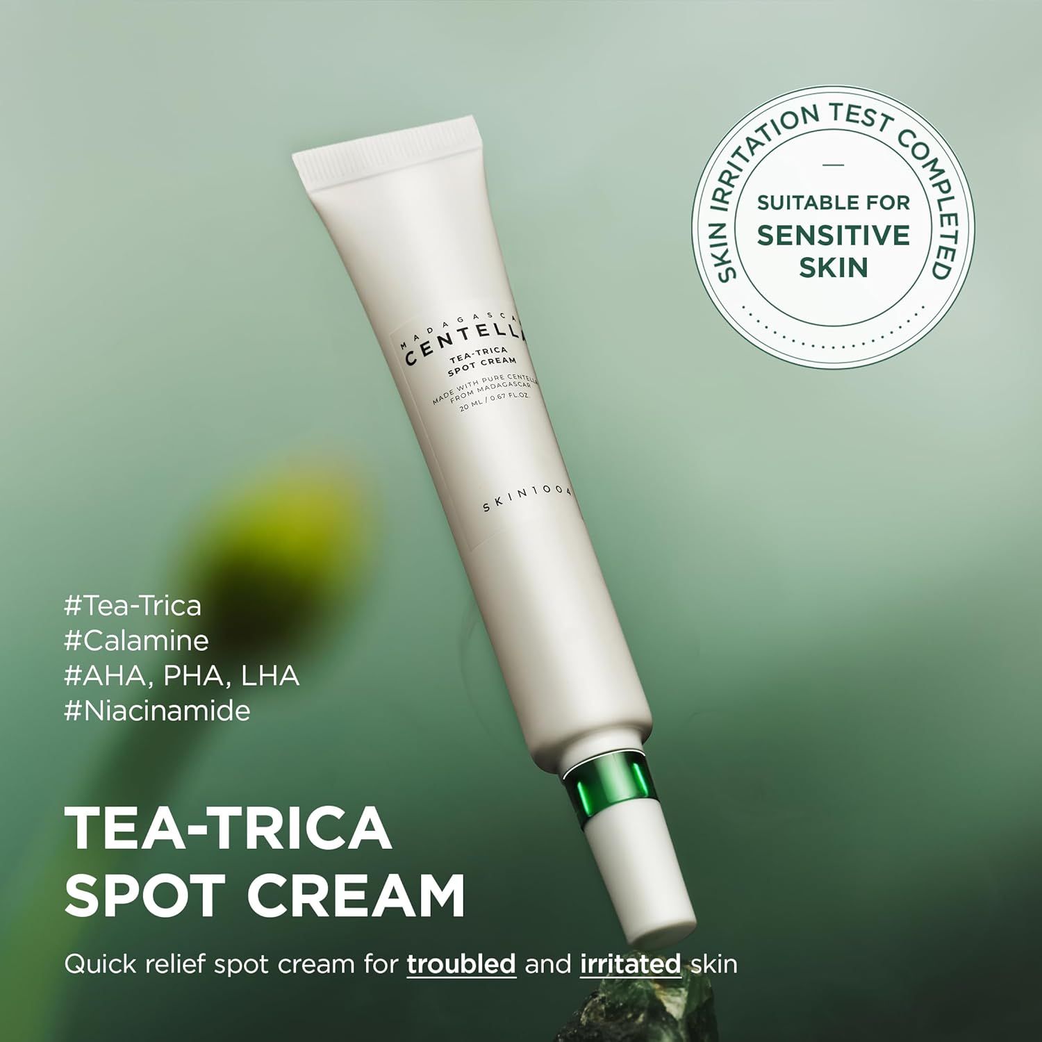 Witte tube met groene dop. Opschrift: Tea-Trica Spot Cream. Op de tube staat SKIN1004. Geschikt voor de gevoelige huid.
