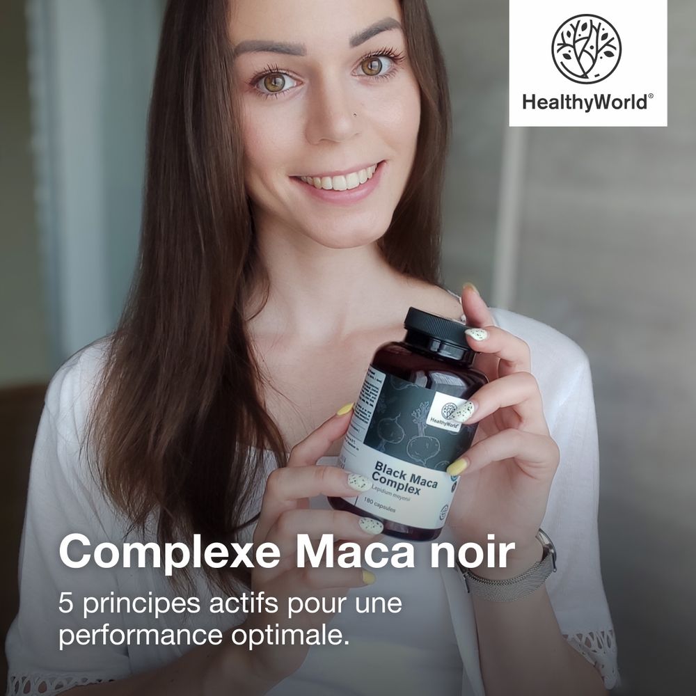 Femme tenant une bouteille de Black Maca Complex. Logo: HealthyWorld. Texte: Complexe Maca noir.