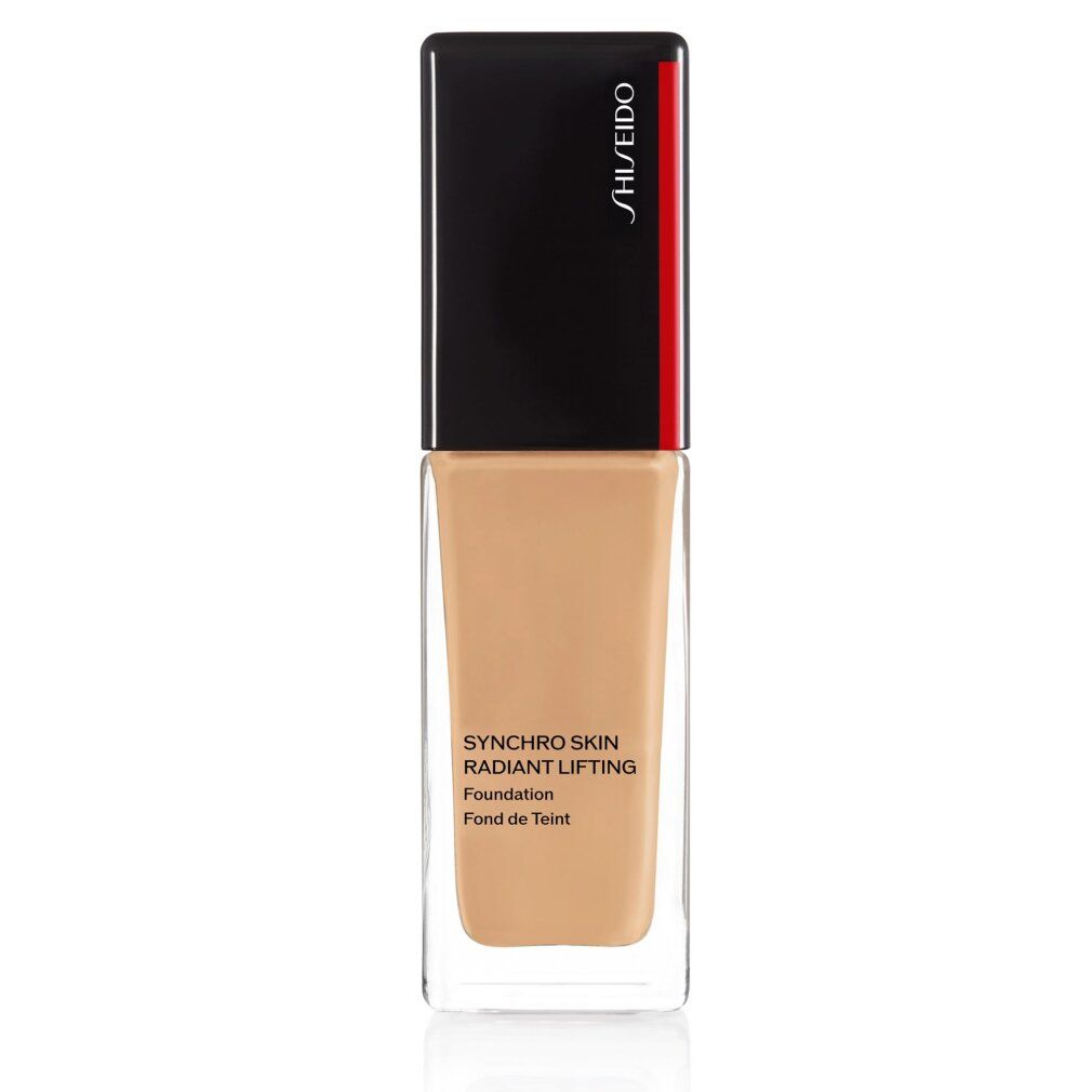 Flacon de fond de teint marron. Bouchon noir avec détail rouge. Inscription: SHISEIDO, SYNCHRO SKIN RADIANT LIFTING Foundation Fond de Teint.