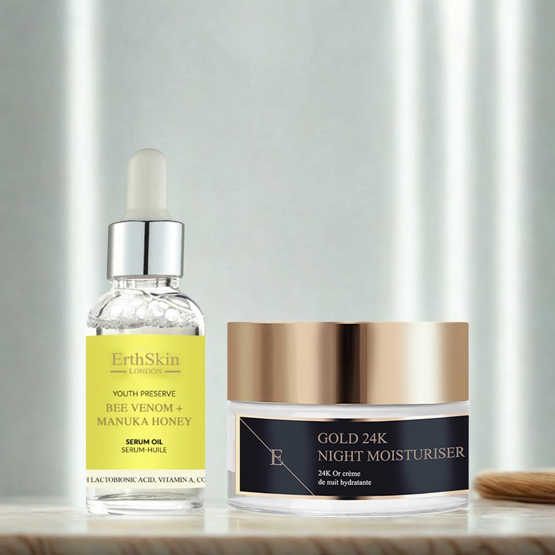 Serumfles en crème pot. Serum met pipet, geel etiket. Crème pot met gouden deksel. Opschrift: Gold 24K Night Moisturiser. Penseel.