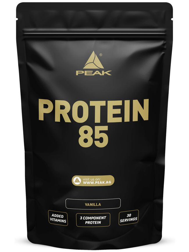 Sachet noir PEAK Protein 85 Vanille avec inscription dorée, logo et informations sur les vitamines, les protéines et la taille de la portion.