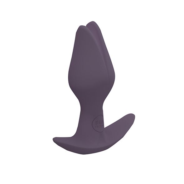 Bouchon anal gris foncé en forme de fleur, vu de côté.