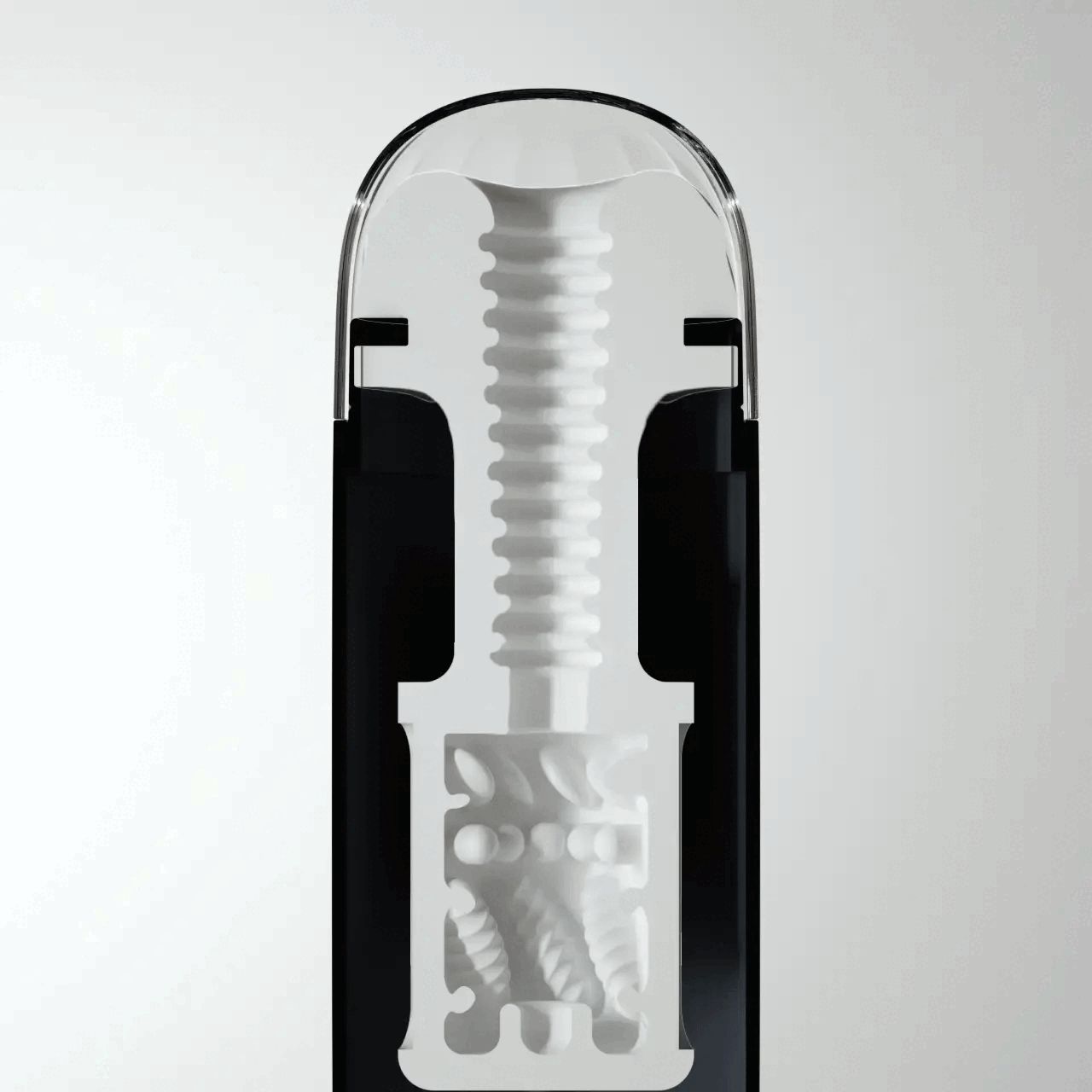 Doorsnede van een zwart apparaat met witte binnenkant. Een schroefstructuur en een gestructureerde kamer zijn zichtbaar.