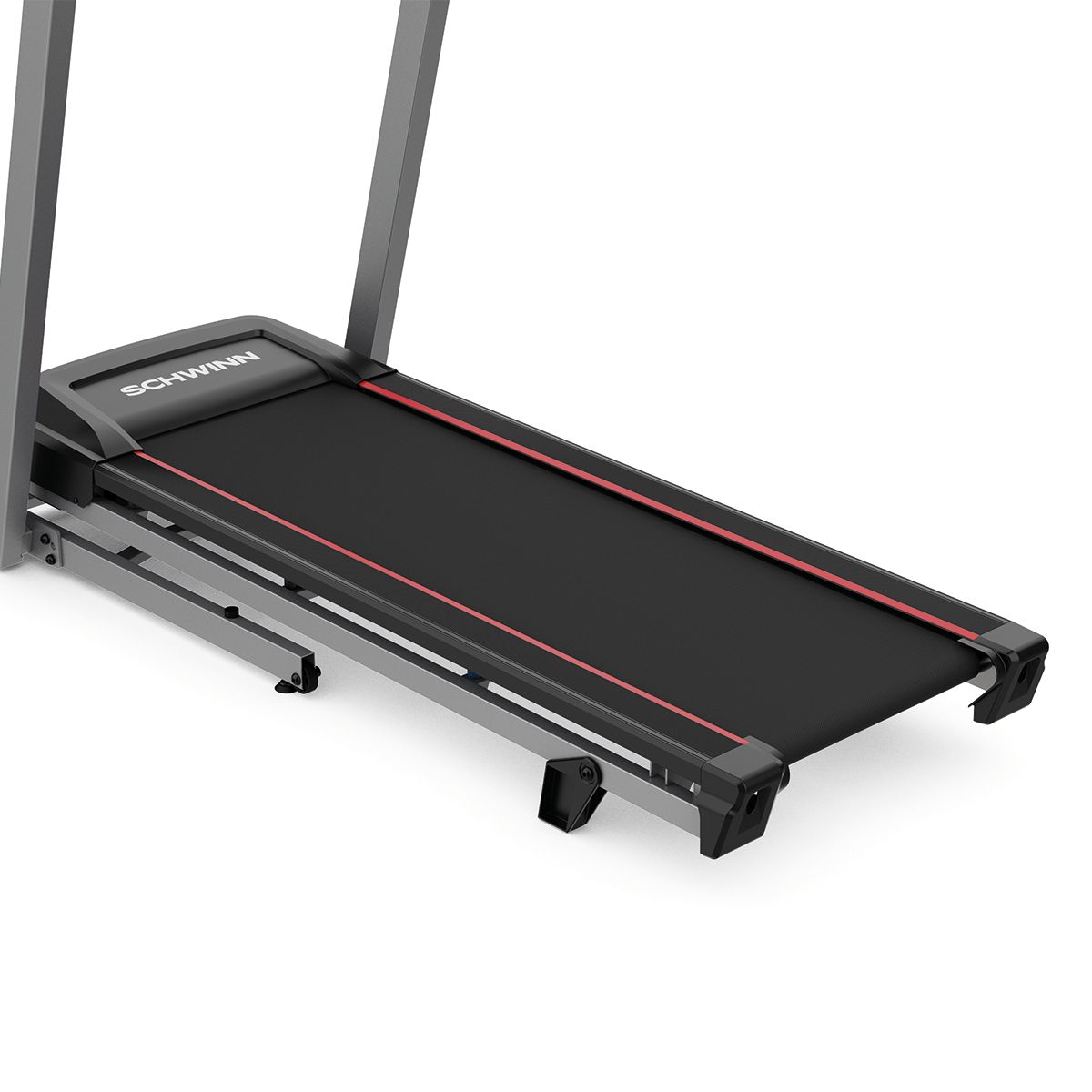 Gros plan sur la surface de course d'un tapis roulant avec ligne rouge. Surface noire avec logo Schwinn.