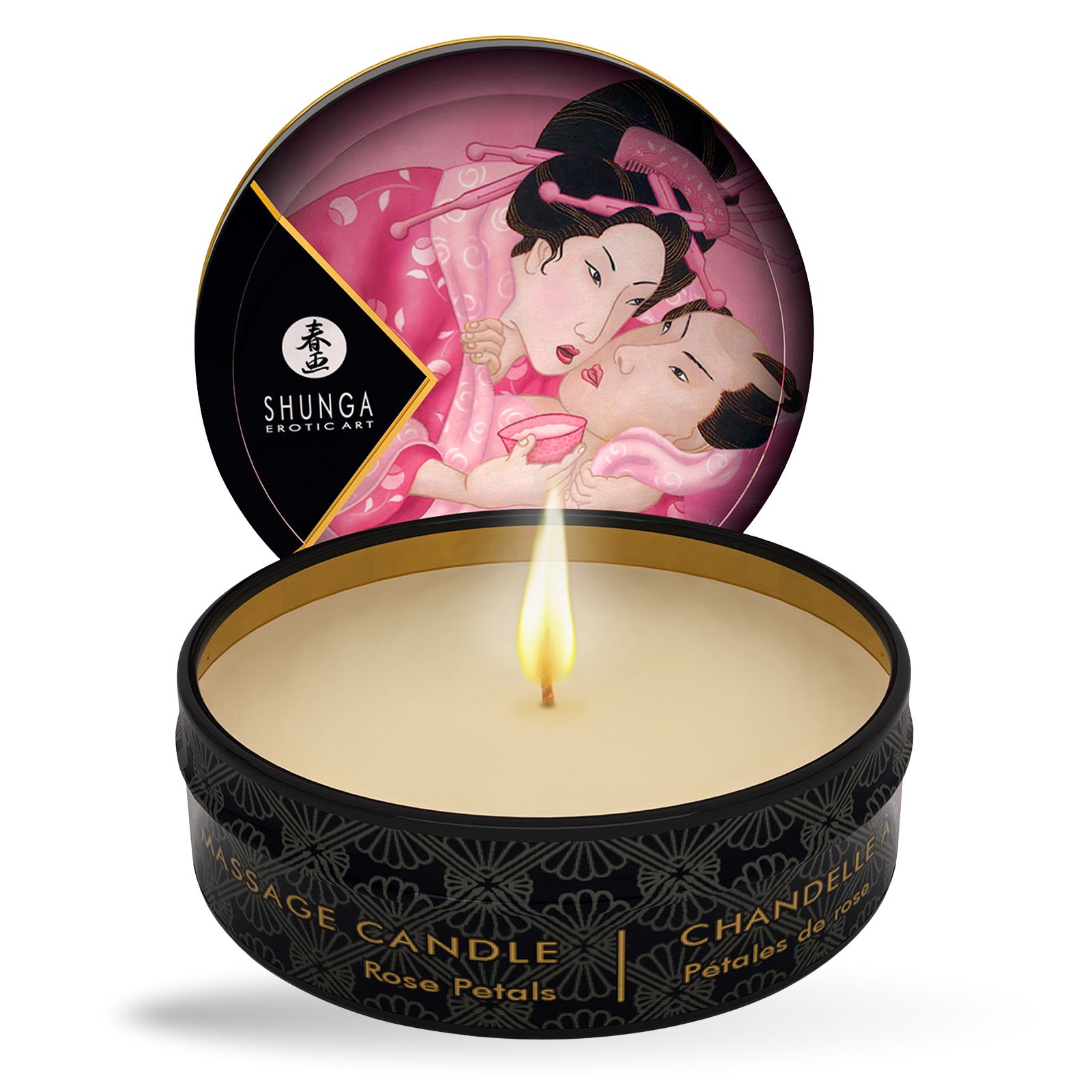 Ronde zwarte kaars met gouden rand. Geïllustreerde deksel. Vlam brandt. Tekst: Massage Candle, Rose Petals.