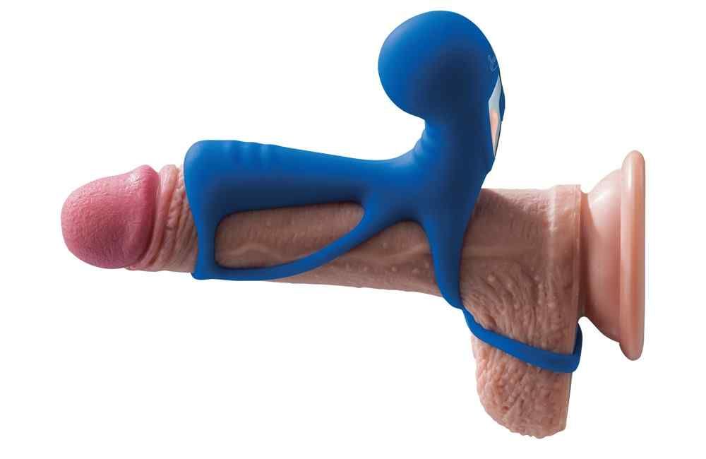 Produit de bien-être bleu fixé sur un modèle de pénis. Ouverture en forme d'anneau. Ventouse.