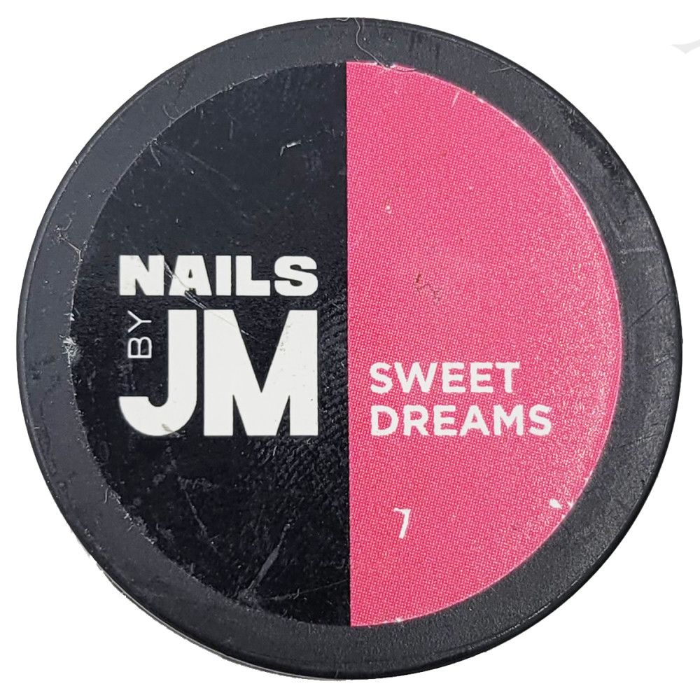 Contenant rond, divisé en noir et rose. Inscription "NAILS BY JM" et "SWEET DREAMS". Numéro 7.