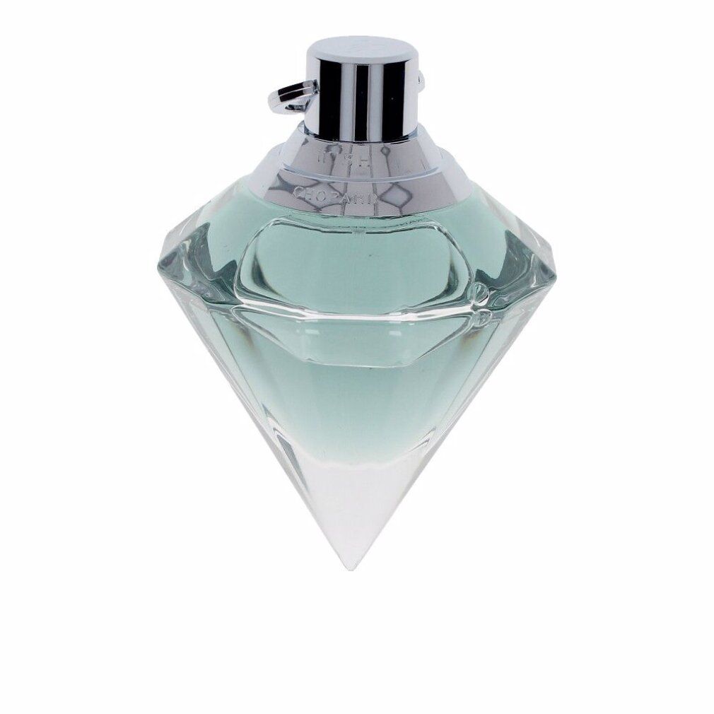 Flacon de parfum en forme de diamant. Liquide vert clair. Fermeture argentée. Inscription sur le bouchon.