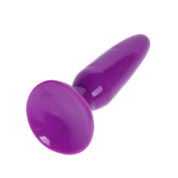 Petit plug anal violet en matière lisse, vu de trois quarts avant.