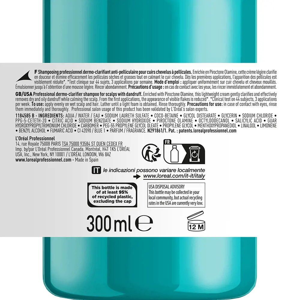 Achterkant van een turquoise shampoo fles. Meertalige tekst, ingrediënten en recycling instructies. 300 ml.