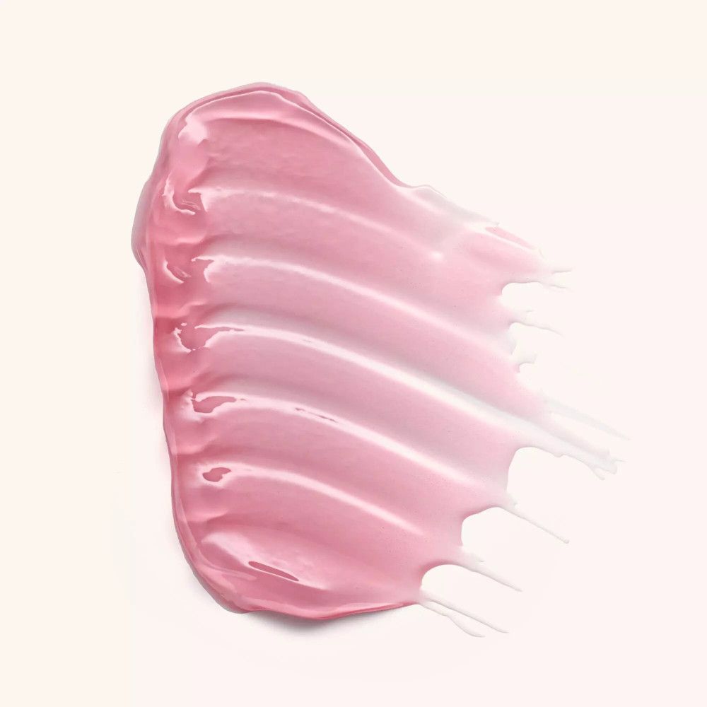 Roze lipolie-veeg. Glanzende textuur. Op lichte achtergrond.