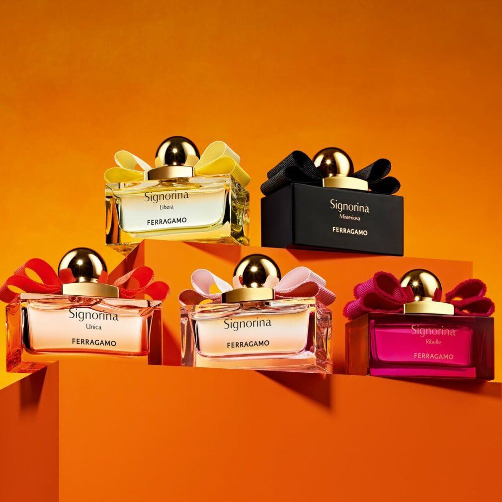 Cinq flacons Salvatore Ferragamo Signorina Eau de Parfum de différentes couleurs.