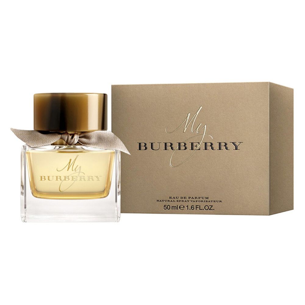 Parfumfles met gouden dop en strik. Daarnaast een goudkleurige doos met de tekst My Burberry.