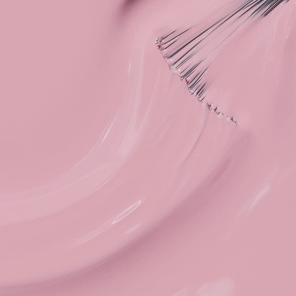 Roze nagellak met penseel. De penseel is in de lak gedompeld en toont de textuur. Glanzend oppervlak.