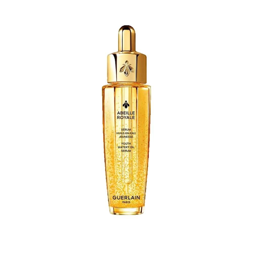 Flacon doré avec bouchon doré. Inscription: Abeille Royale, Sérum Huile en Eau Jeunesse, Guerlain Paris.
