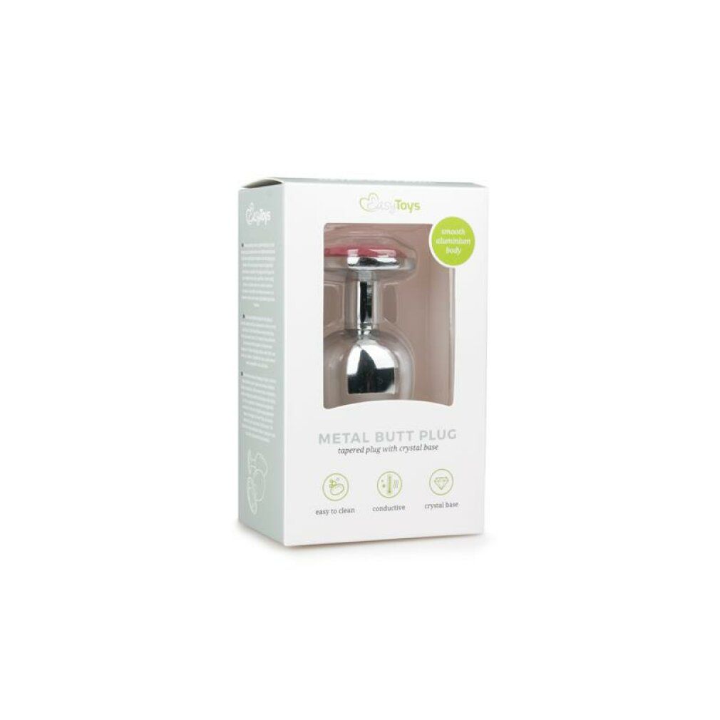 Emballage pour un plug anal. Nom du produit : METAL BUTT PLUG. Avec pierre rose. Caractéristiques : facile à nettoyer, conducteur, cristal clair.